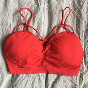Red cross-cross passed cross-cross front bralette.
